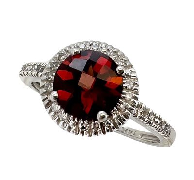 A classic and colorful 14K white gold ring set with white diamonds around a 1.25ct garnet