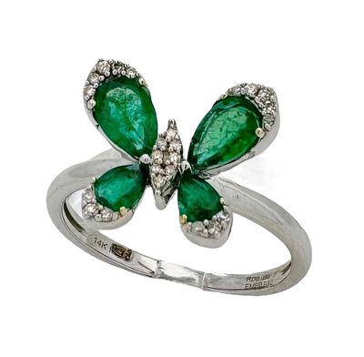 14K white gold ring with a special butterfly-like design, set with emerald gemstones as wings
