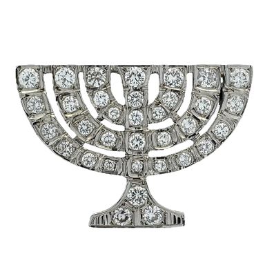 A 14K white gold brooch with a very special menorah like design set with approximately 3.10ct