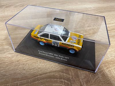 IXO FORD ESCORT MK11 RAC RALLY 1977 RUSSELL BROOKS/ JOHN BROWN CASED AND BOXED