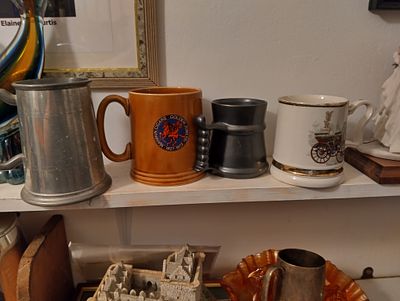 NICE SELECTION OF FOUR TANKARDS INCLUDING 22KT PRINCE WILLIAM, PEWTER ETC
