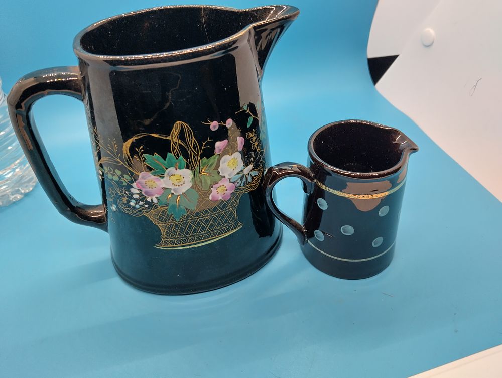 VERY COLLECTIBLE two pieces of Victorian Jet ware Hand-Painted Enamelled Black Tableware including TWO JUGS