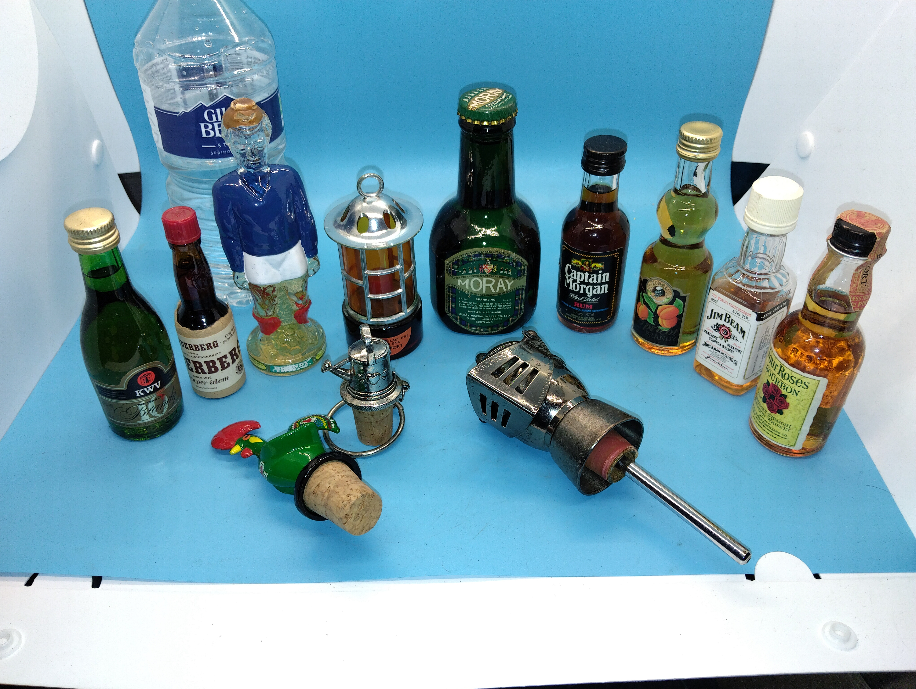NICE SELECTION OF BRANDY AND WHISKY MINITURES ALONG WITH WINE STOPPERS INCLUDING KNIGHTS HELMET ETC