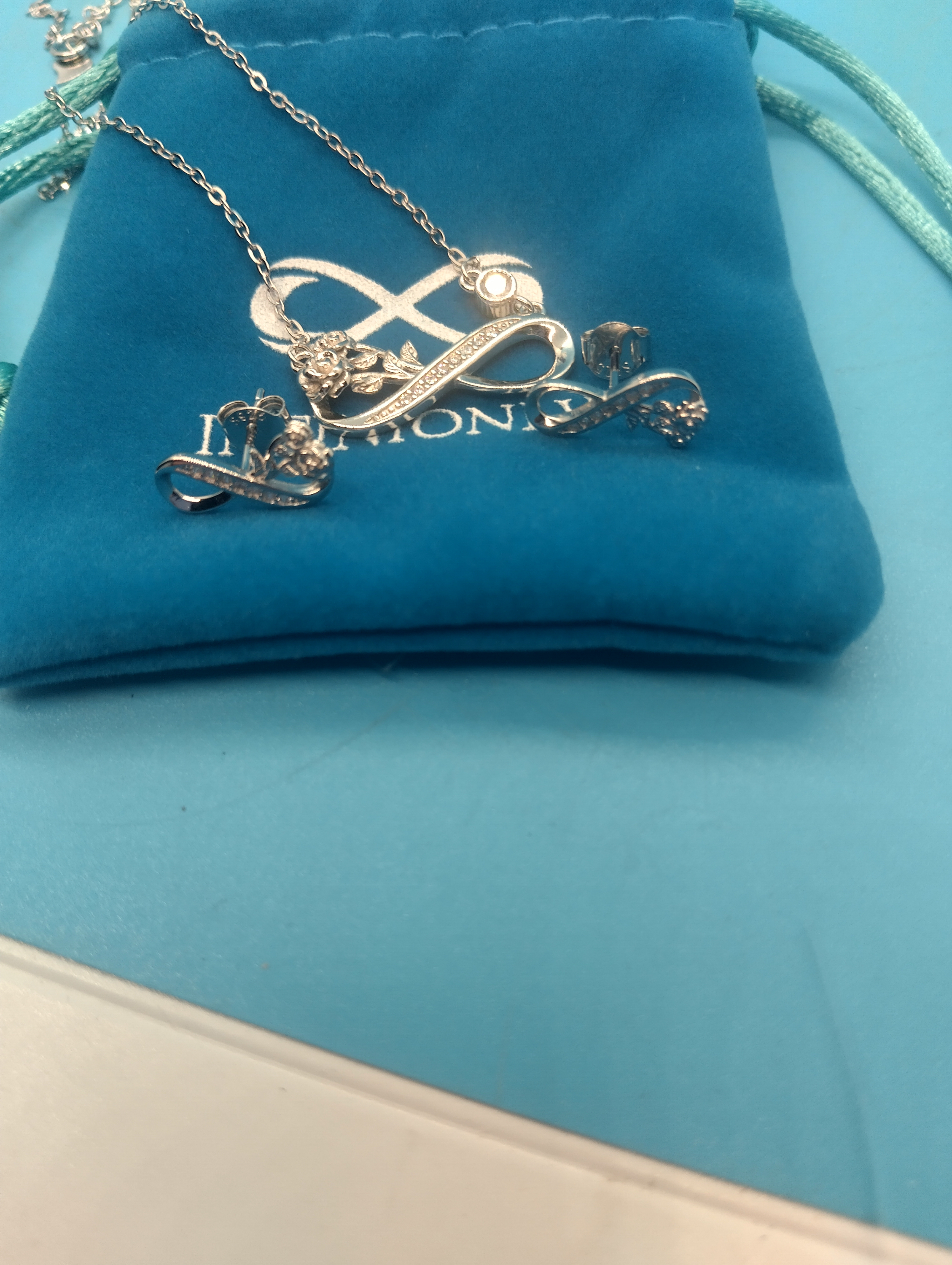 NEW SILVER INFINITY NECKLACE AND EARINGS SET