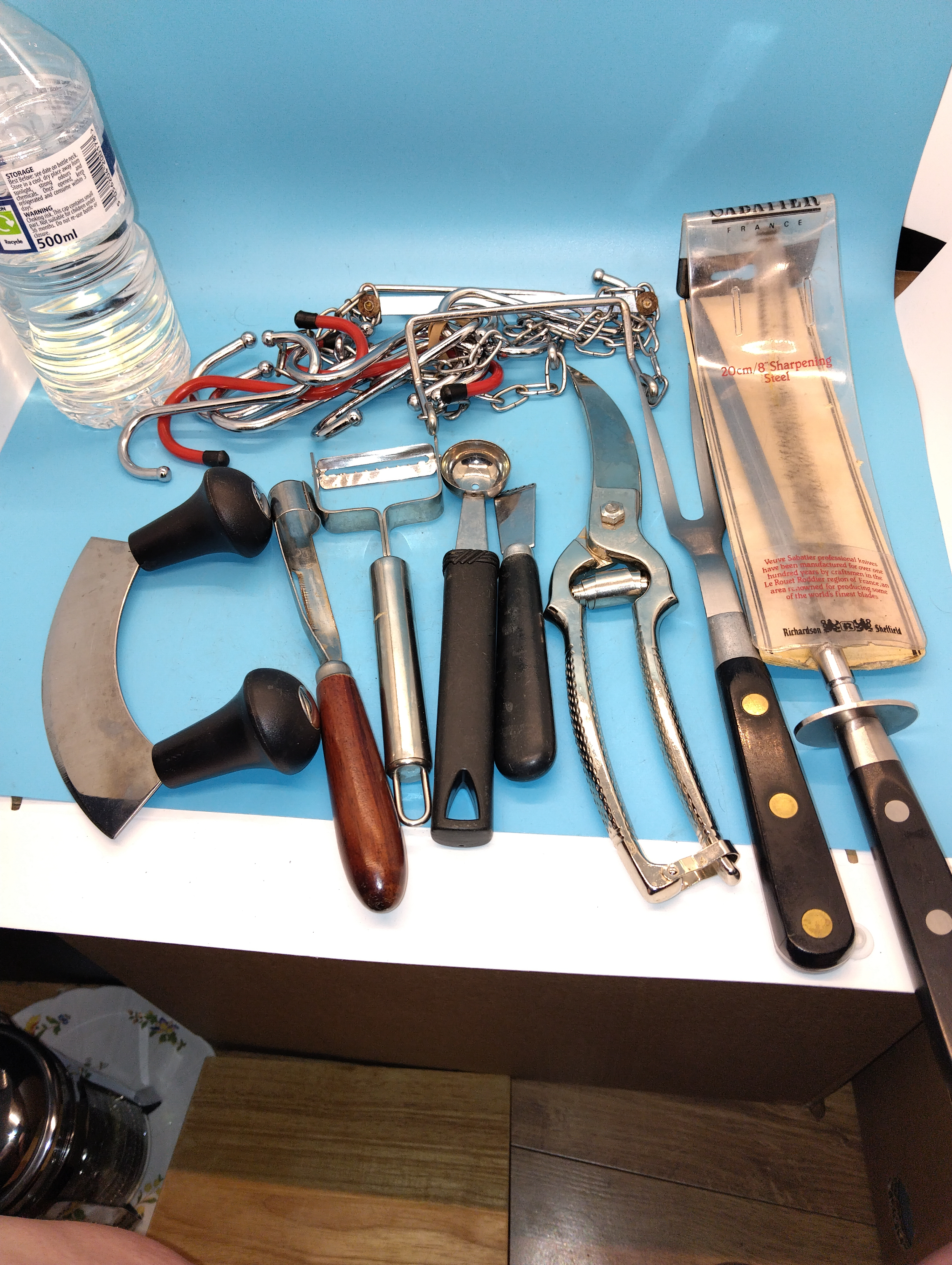 VERY NICE SELECTION OF UNUSED QUALITY UTENSILS INCLUDING HANGING PAN RACK, HERB CHOPPER,  ETC