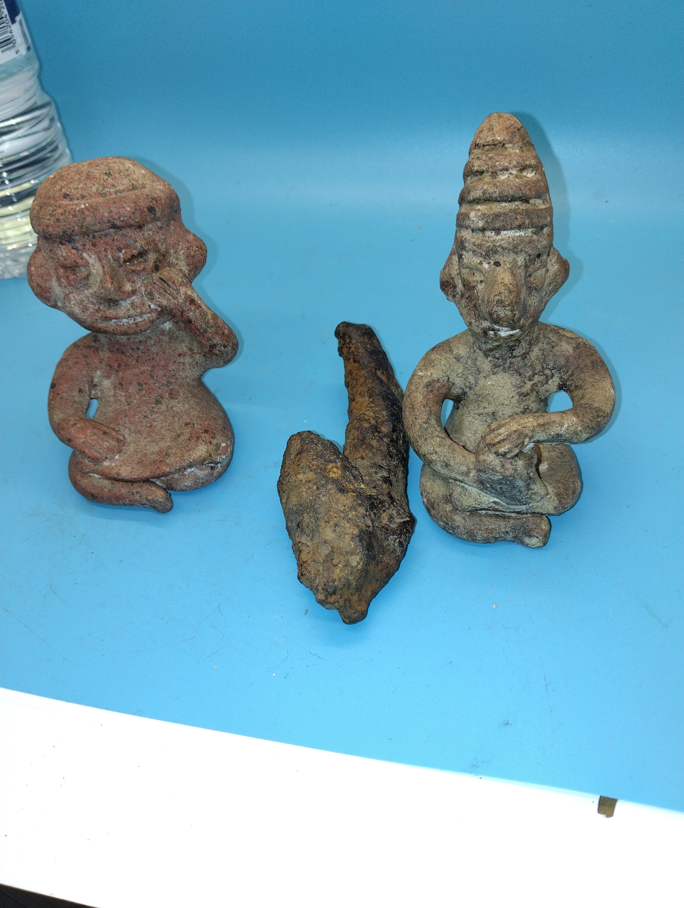 THREE ANTIQUE ROMANESQUE FINDS INCLUDING TWO FIGURES AND POSSIBLE ARROW HEAD