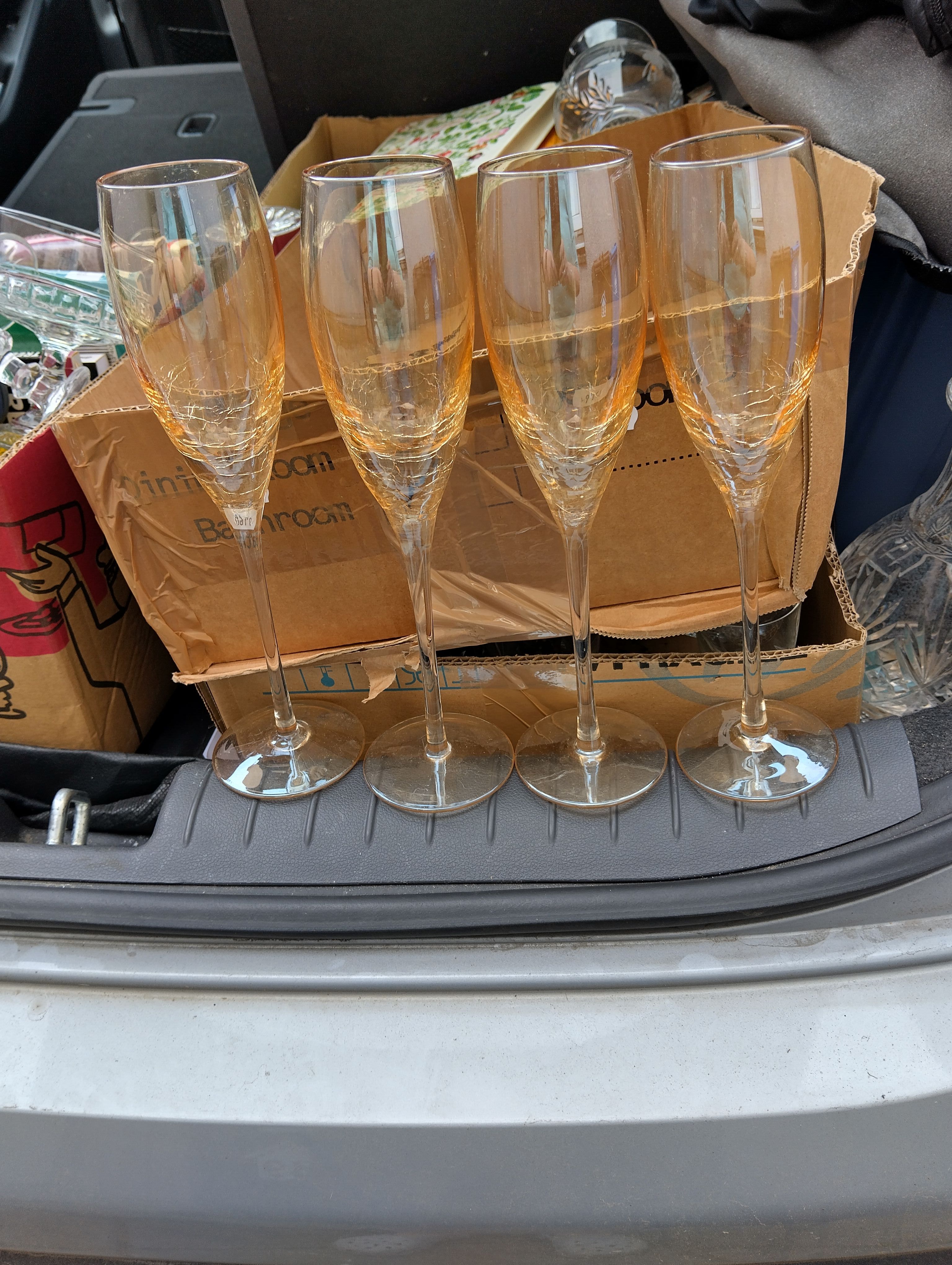 A Set of Amber-Tinted Crackle Glass Champagne Flutes