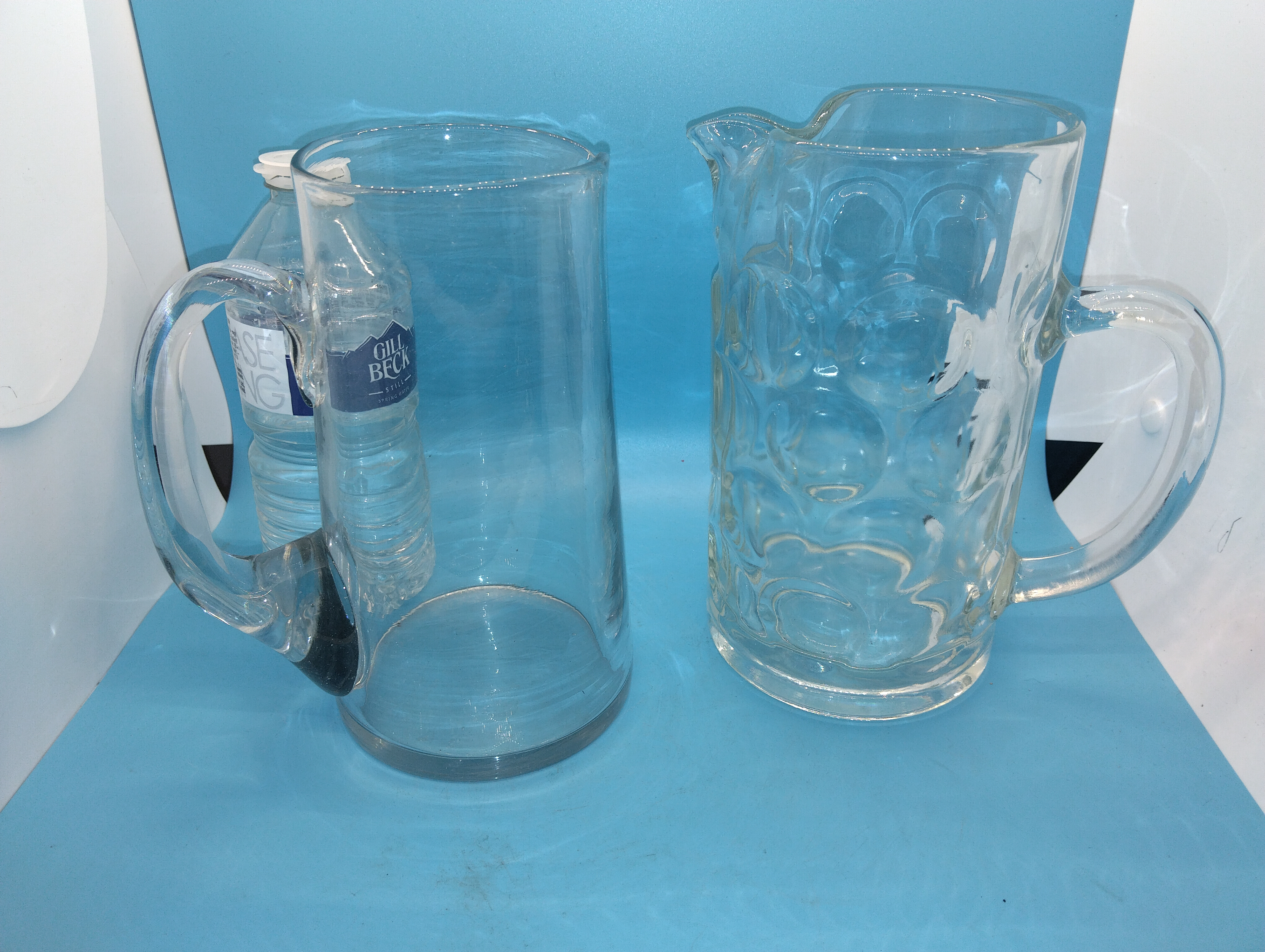 Two Clear Glass Pitchers including an Oktoberfest Style Dimpled Mug