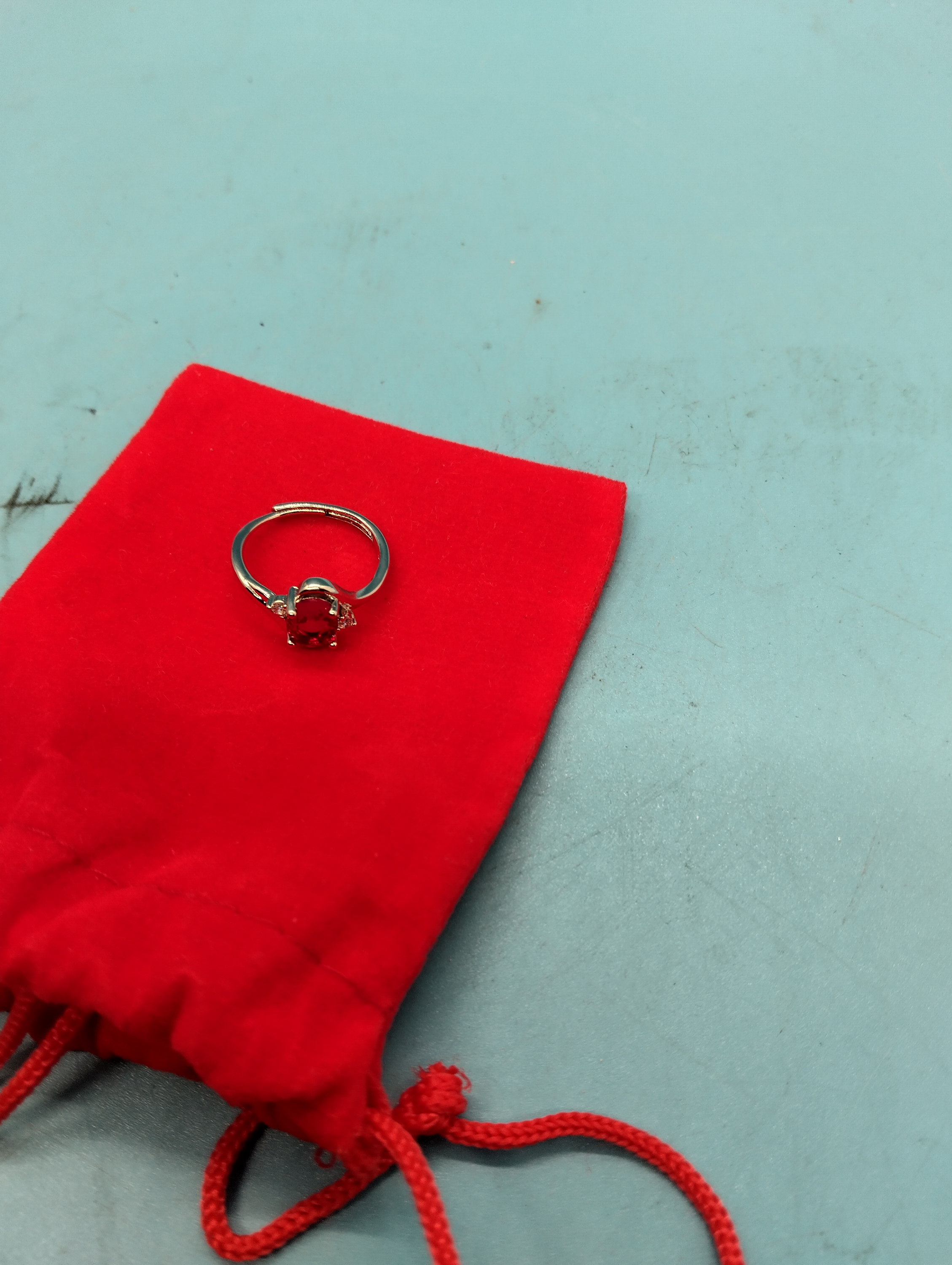 A NEW LOVELY SILVER RING WITH RED STONE WITH PRESENTATION POUCH