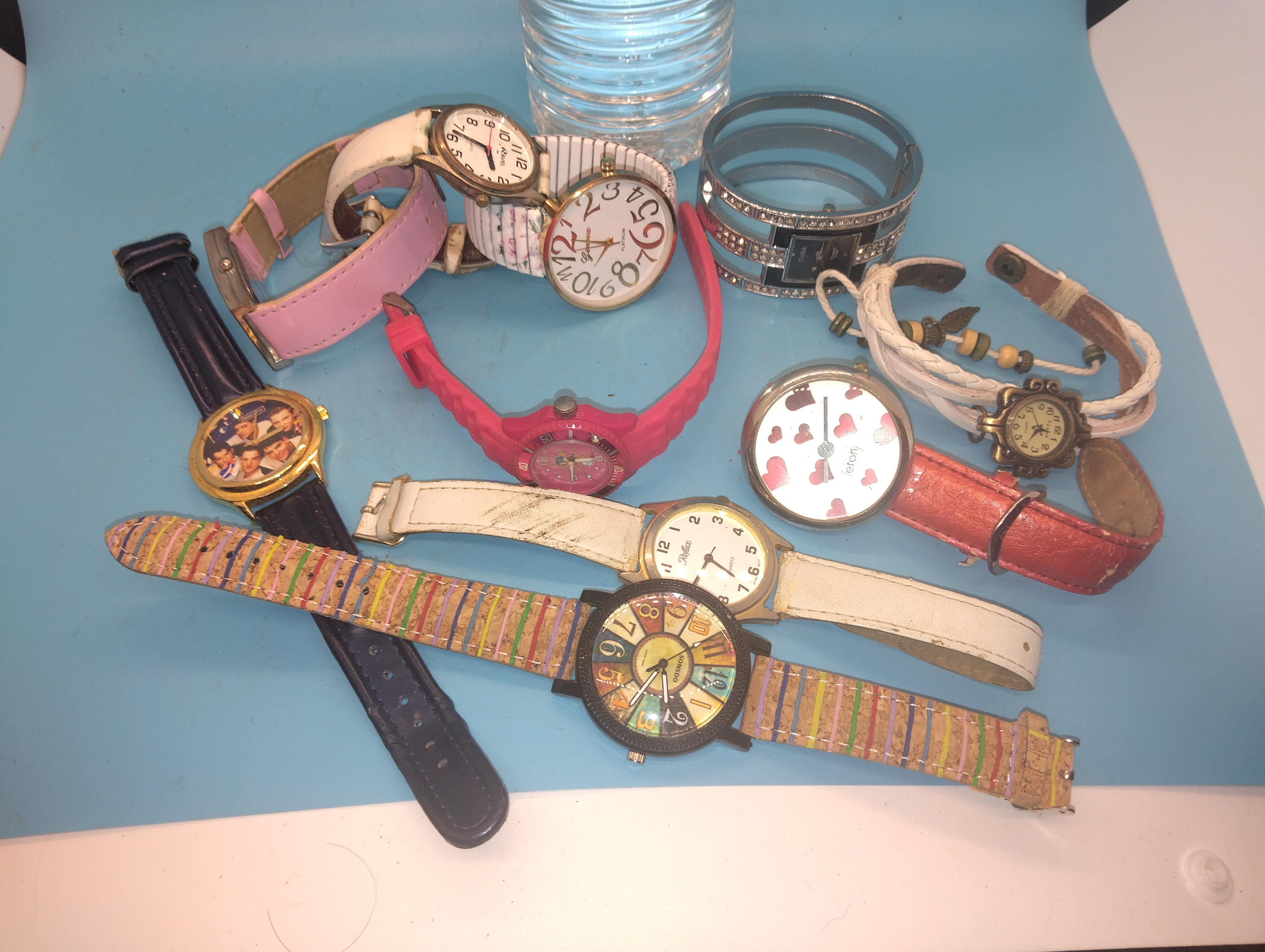An Assortment of Modern Fashion Wristwatches and a Decorative Cuff Timepiece