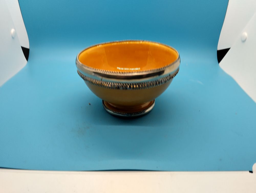 A Moroccan Safi Pottery Footed Bowl with White Metal Mounts