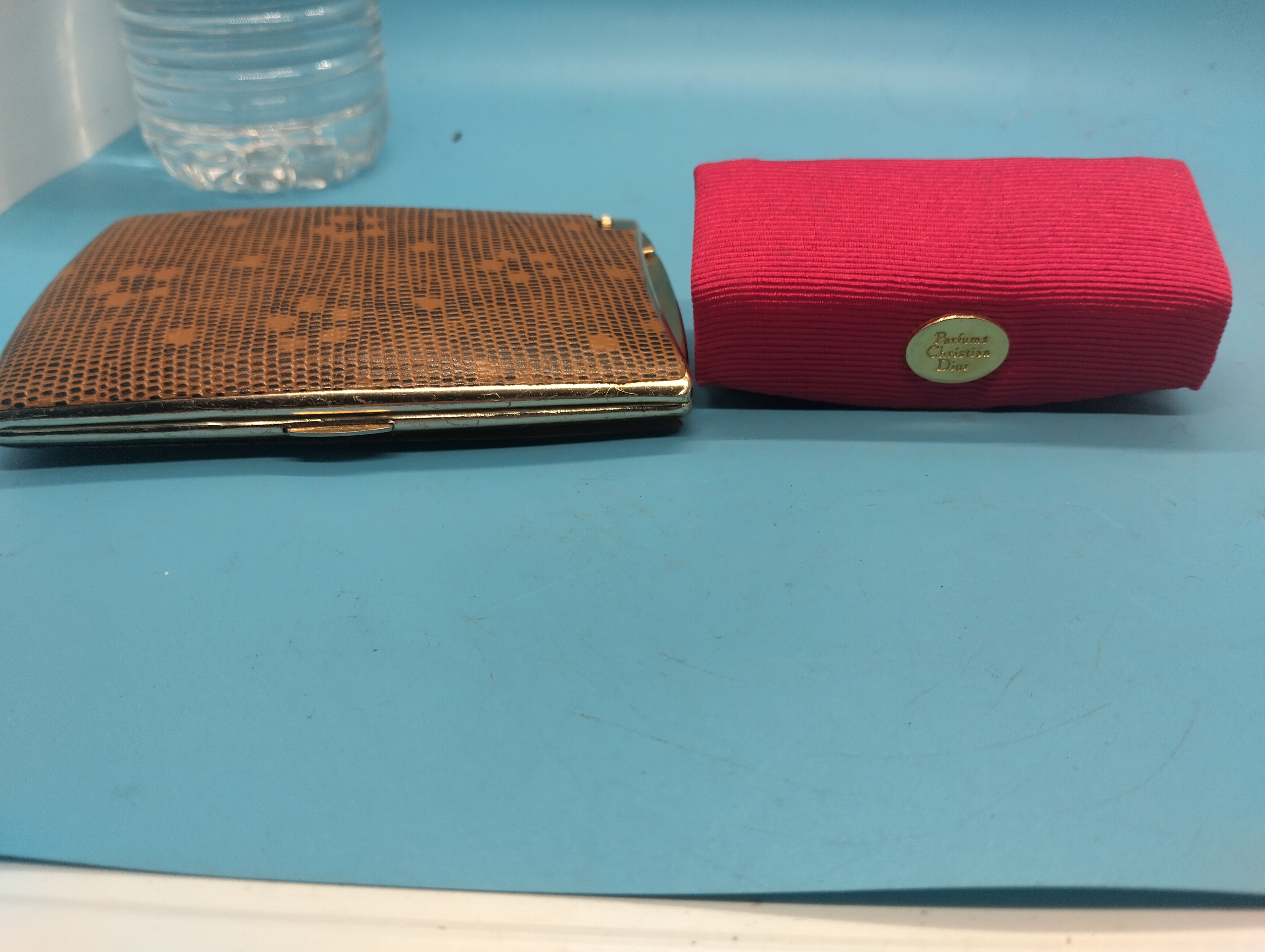 NICE LADIES CHRISTIAN DIOR PERFUME SPRAY IN CASE AND AN CIGARETTER CASE WITH BUILT IN LIGHTER