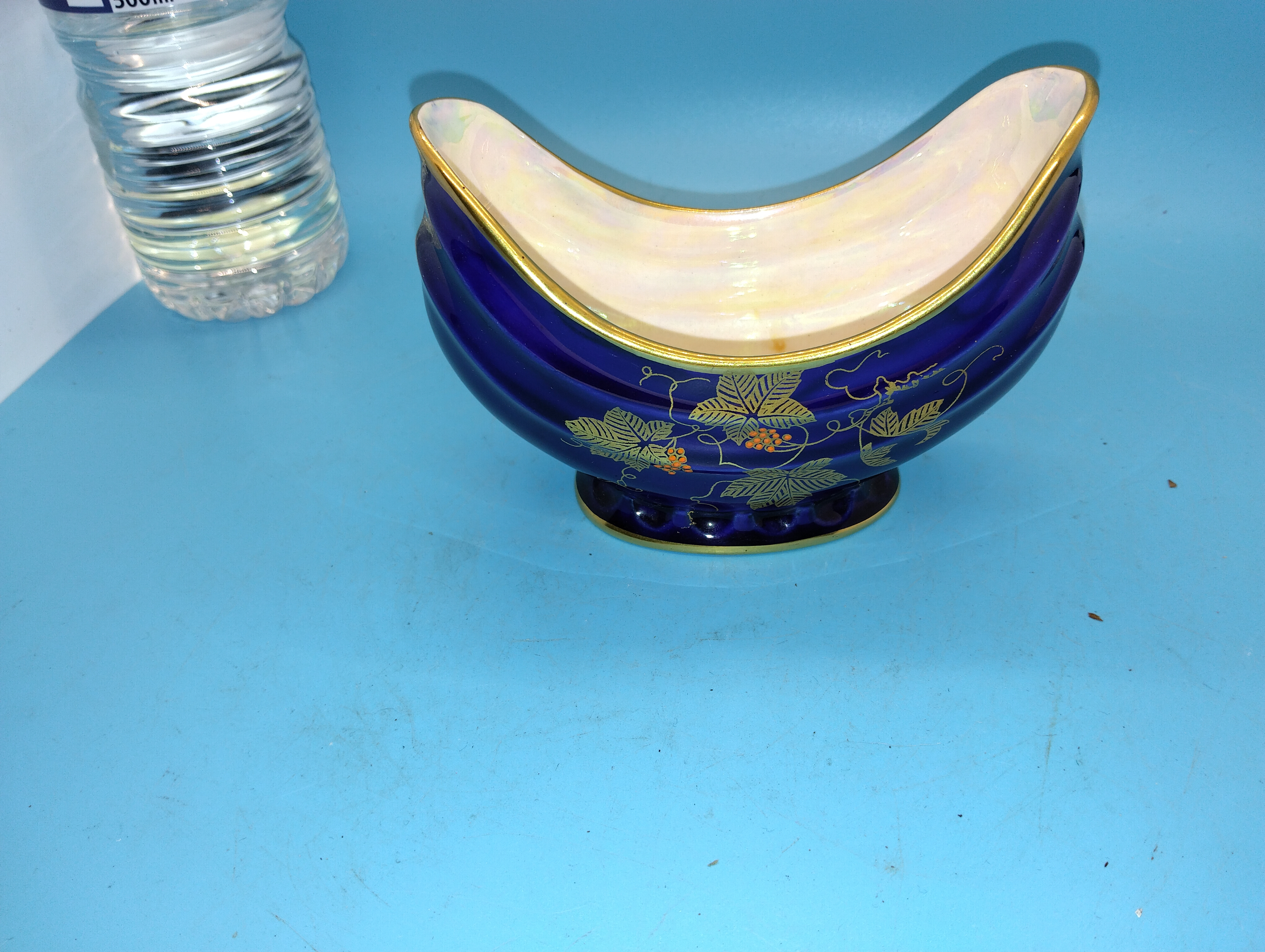 A Crown Devon Fieldings boat-shaped ceramic pedestal bowl