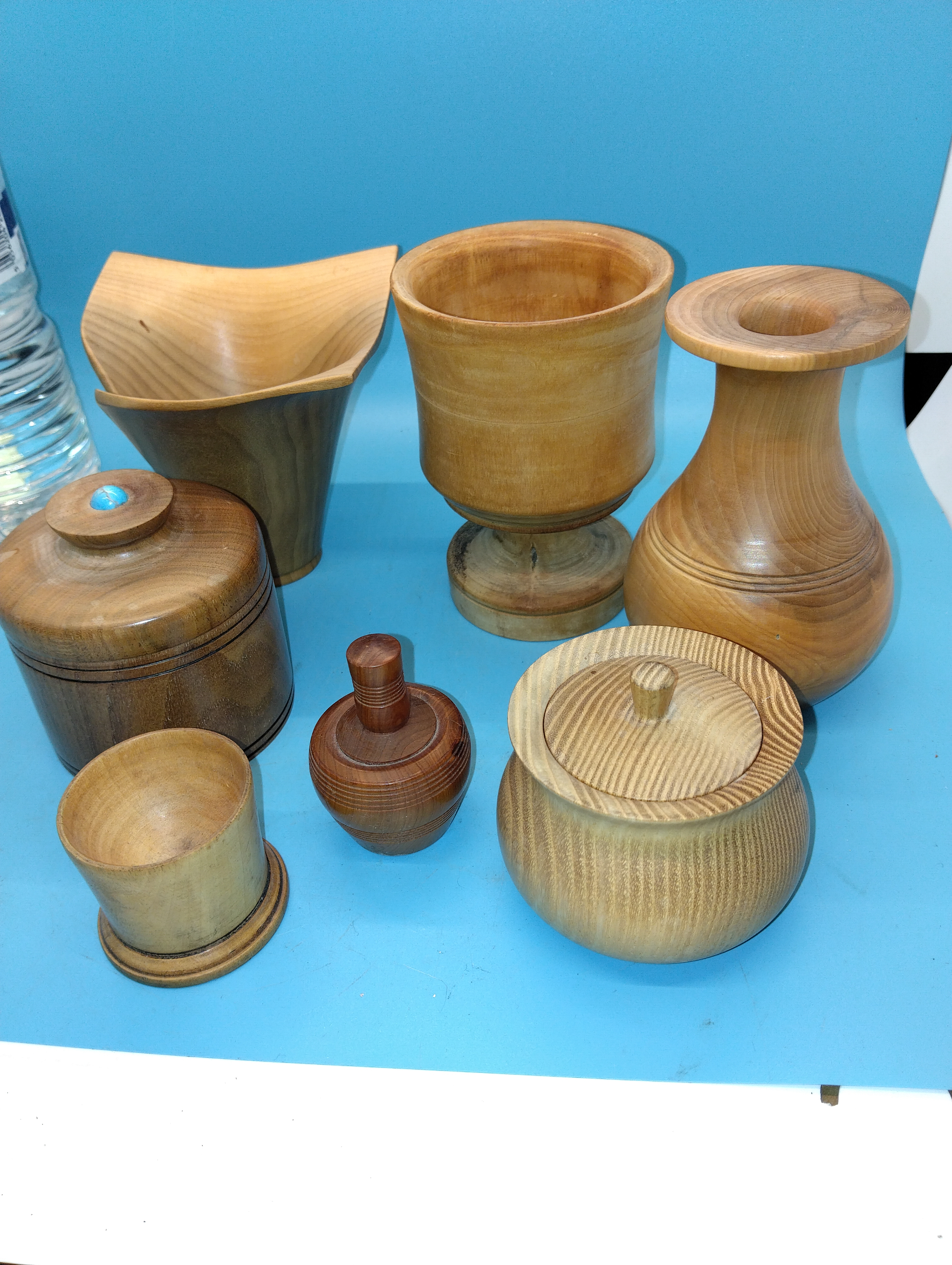 A Collection of Artisanal Hand-Turned Wooden Decorative Vessels and Lidded Jars