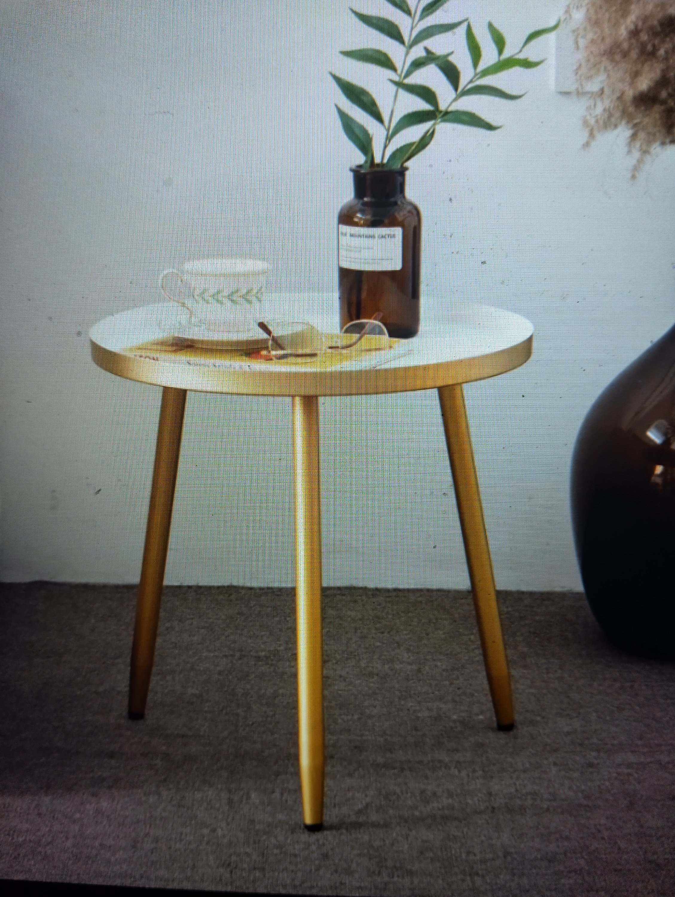 A NEW BOXED contemporary round side table with gold-toned trim and tripod legs