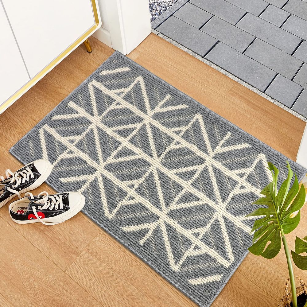 A NEW contemporary rectangular geometric patterned accent rug in slate grey and off-white