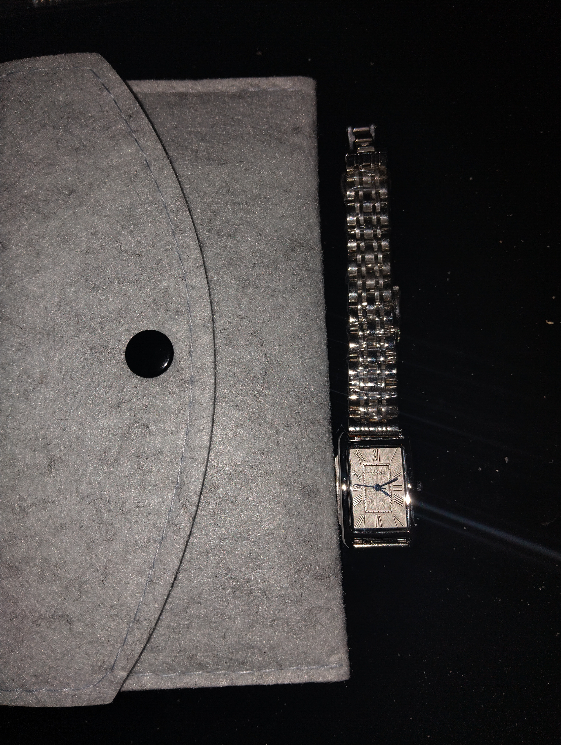 A rectangular silver-toned ORSA wristwatch with multi-link bracelet