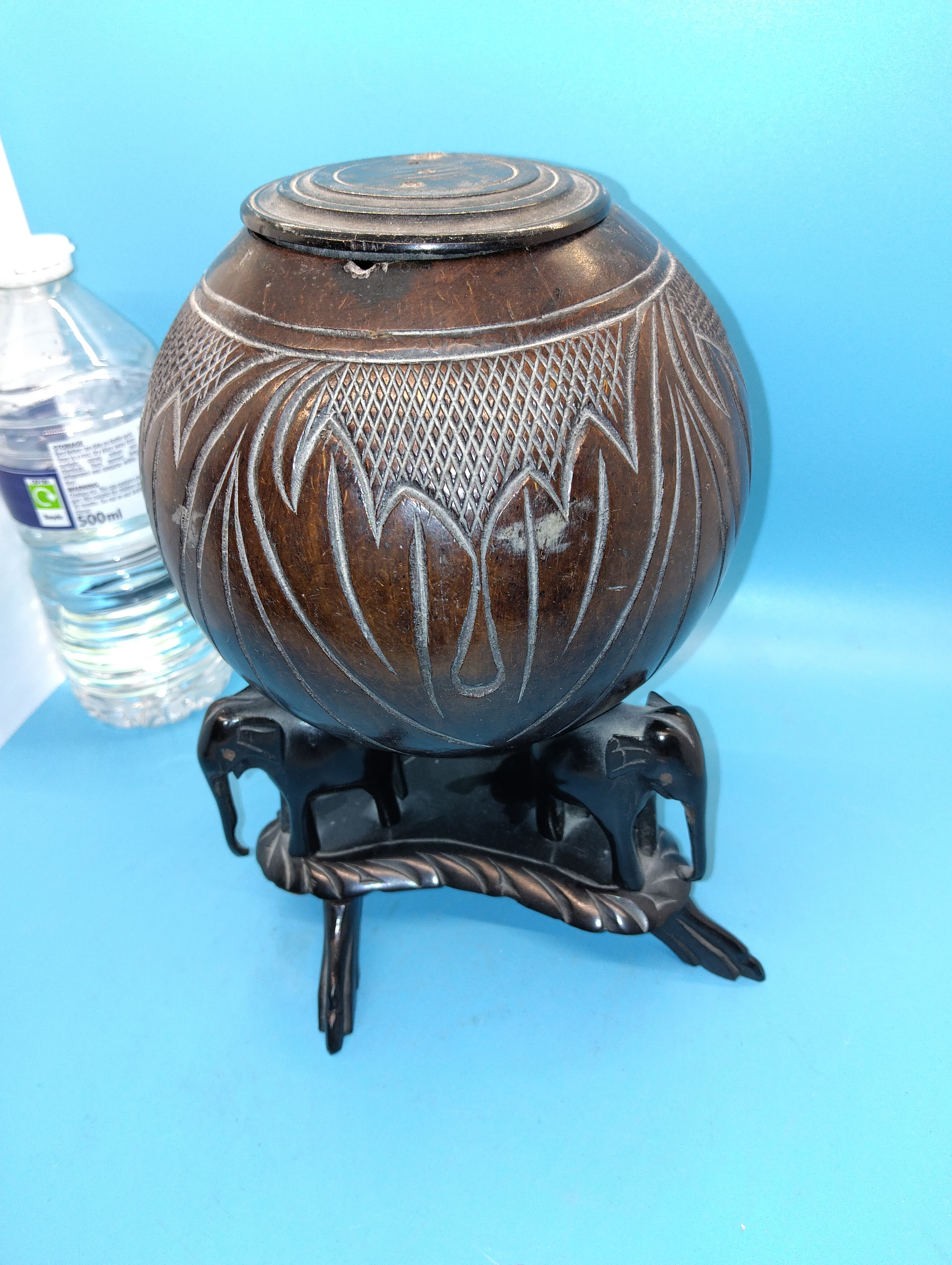RARE AFRICAN COCONUT LIDDED BULBAS POT ON TRI ELEPHANT STAND