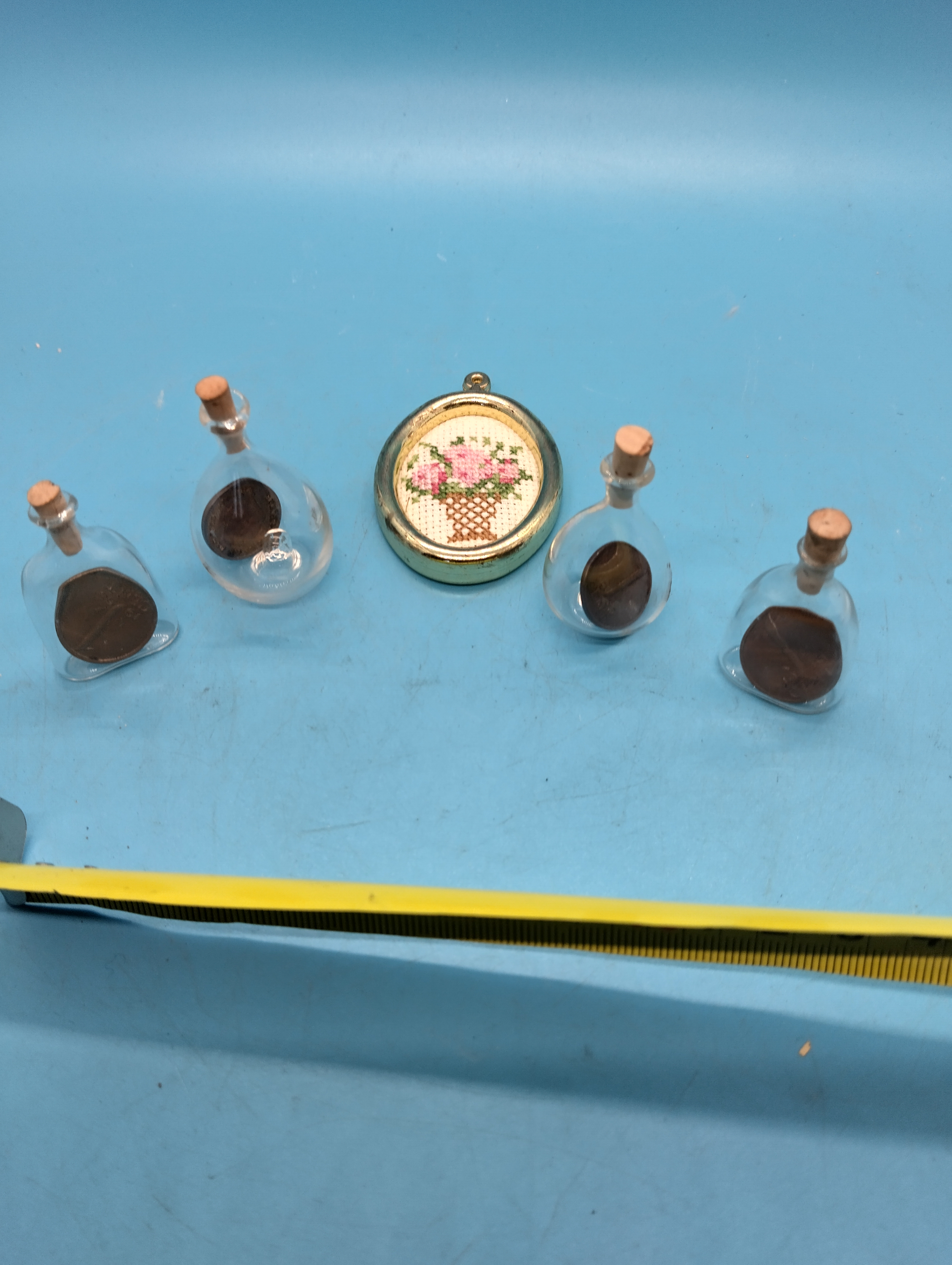 NICE SELECTION OF MINITURE LUCKY GLASS PERFUME BOTTLES WITH 1 CENT IN EACH ETC