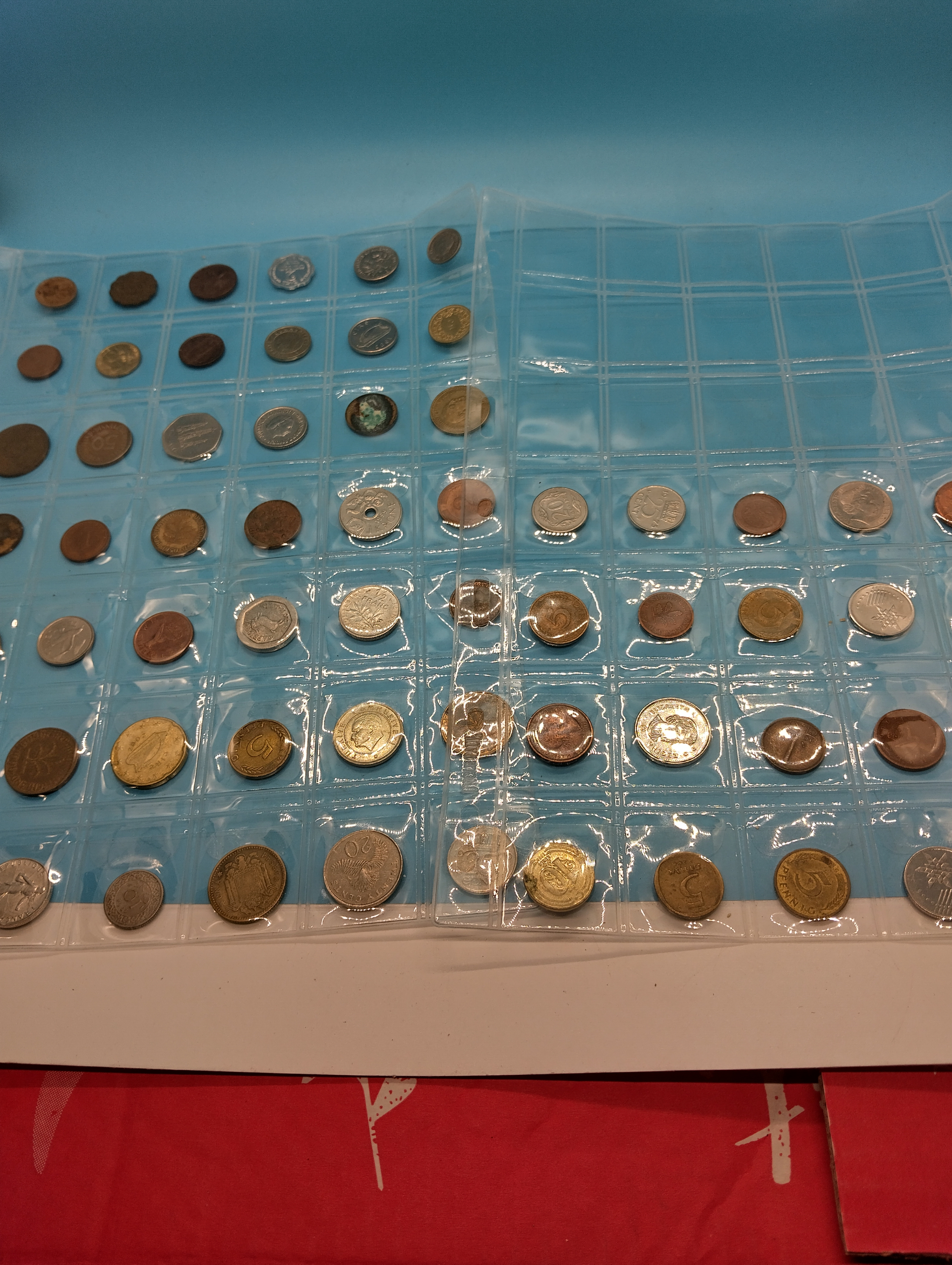 TWO SHEETS OF INTERNATIONAL AND UK COLLECTIBLE COINS