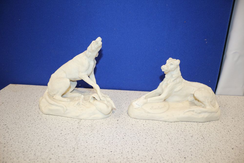 Lot 244: A Pair of Copeland Parian 'Sentinel' Dog Statues