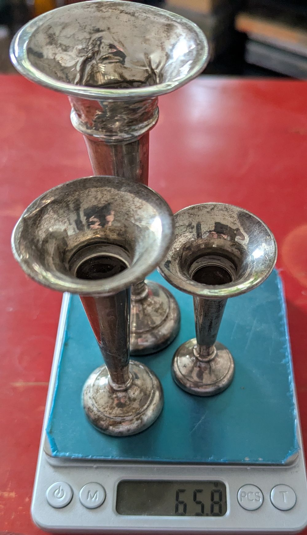 Lot 159: A Graduated Trio of Commemorative Year Sterling Silver Trumpet Vases