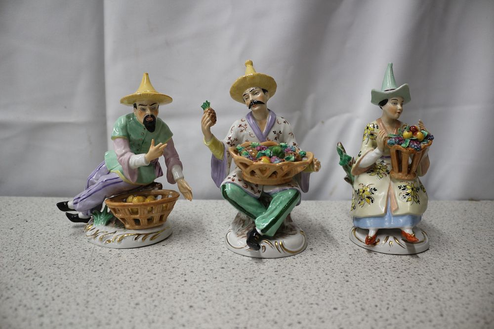 Lot 214: Three Sitzendolf Porcelain Figurines with Fruit Baskets
