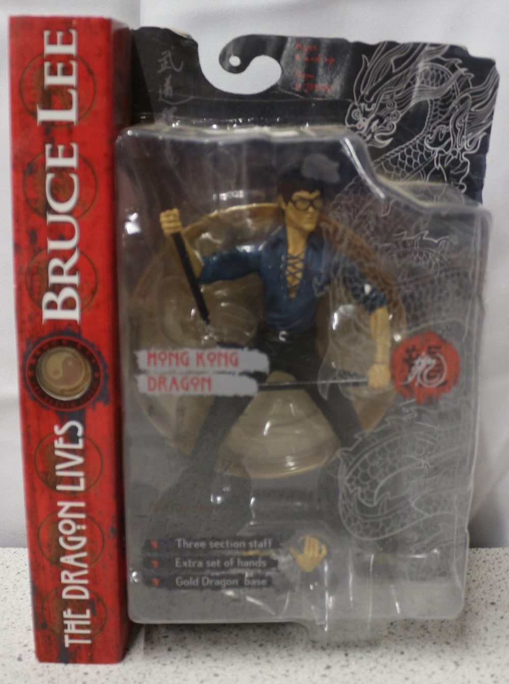 Lot 272: Art Asylum Bruce Lee "Hong Kong Dragon" Action Figure with "The Dragon Lives" Box