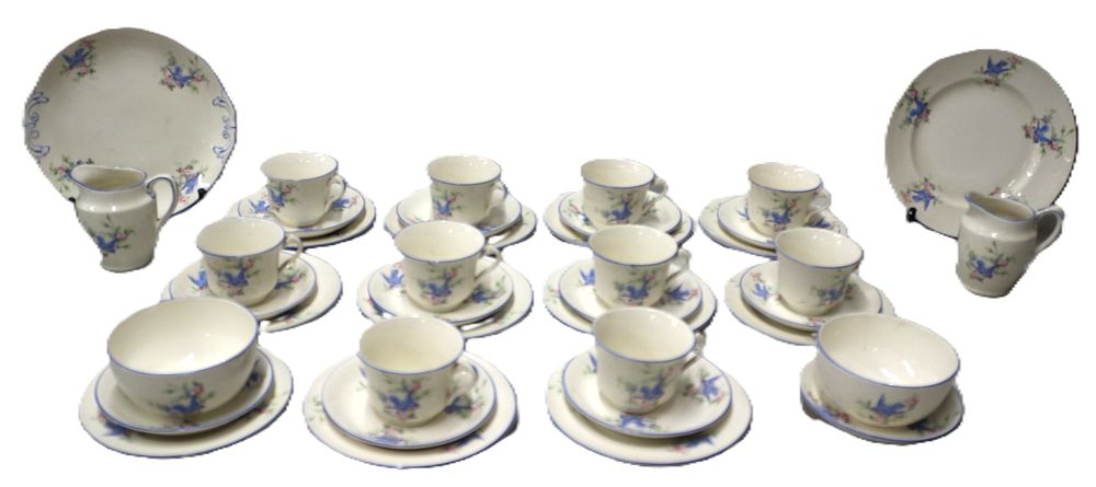 Lot 276: A Partial Mid-20th Century Scotch Ivory Ceramic Dinner and Tea Service, Decorated with Blue Birds and Pink Roses