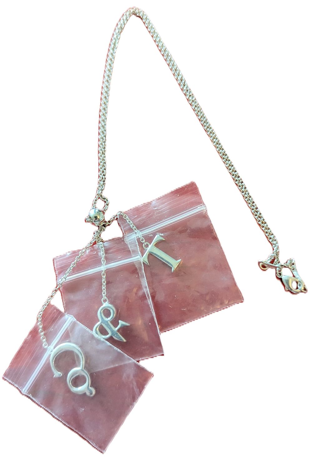Lot 317: TIFFANY&CO. Marked, Sterling Silver Chain Necklace with Three Charms