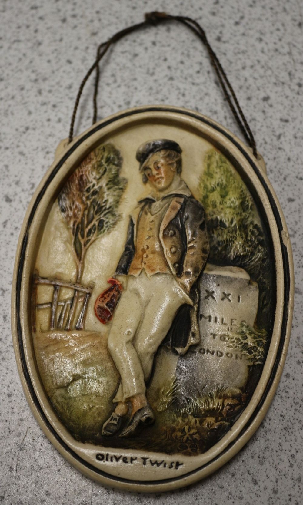 Lot 321: An Ivorex 'Oliver Twist' Wall Plaque