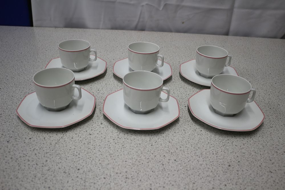 Lot 396: A Set of Six Villeroy & Boch Facette Rouge Porcelain Cups and Saucers
