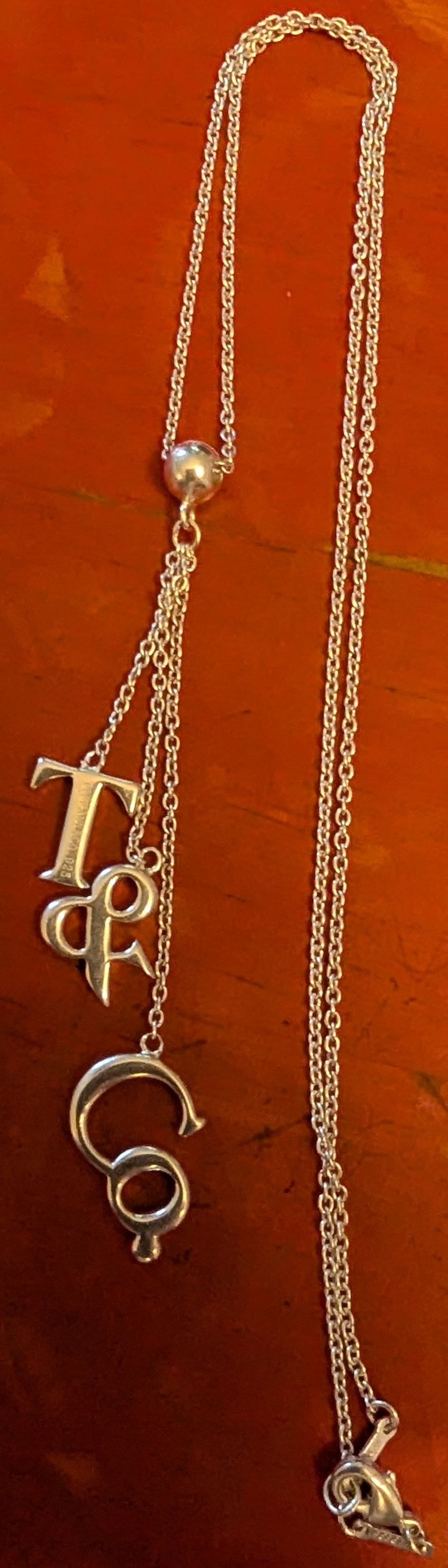 Lot 407: Tiffany & Co. Marked Sterling Silver Logo Lariat Necklace