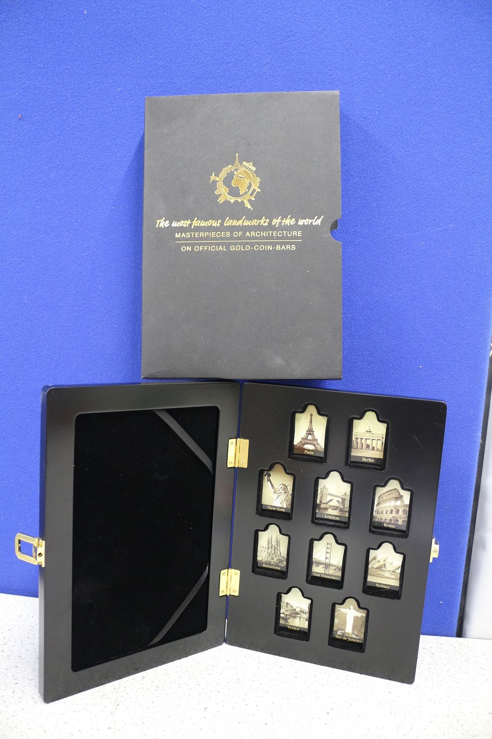 Lot 193: An Empty Case for Ten Famous Landmarks Gold-Coin-Bars