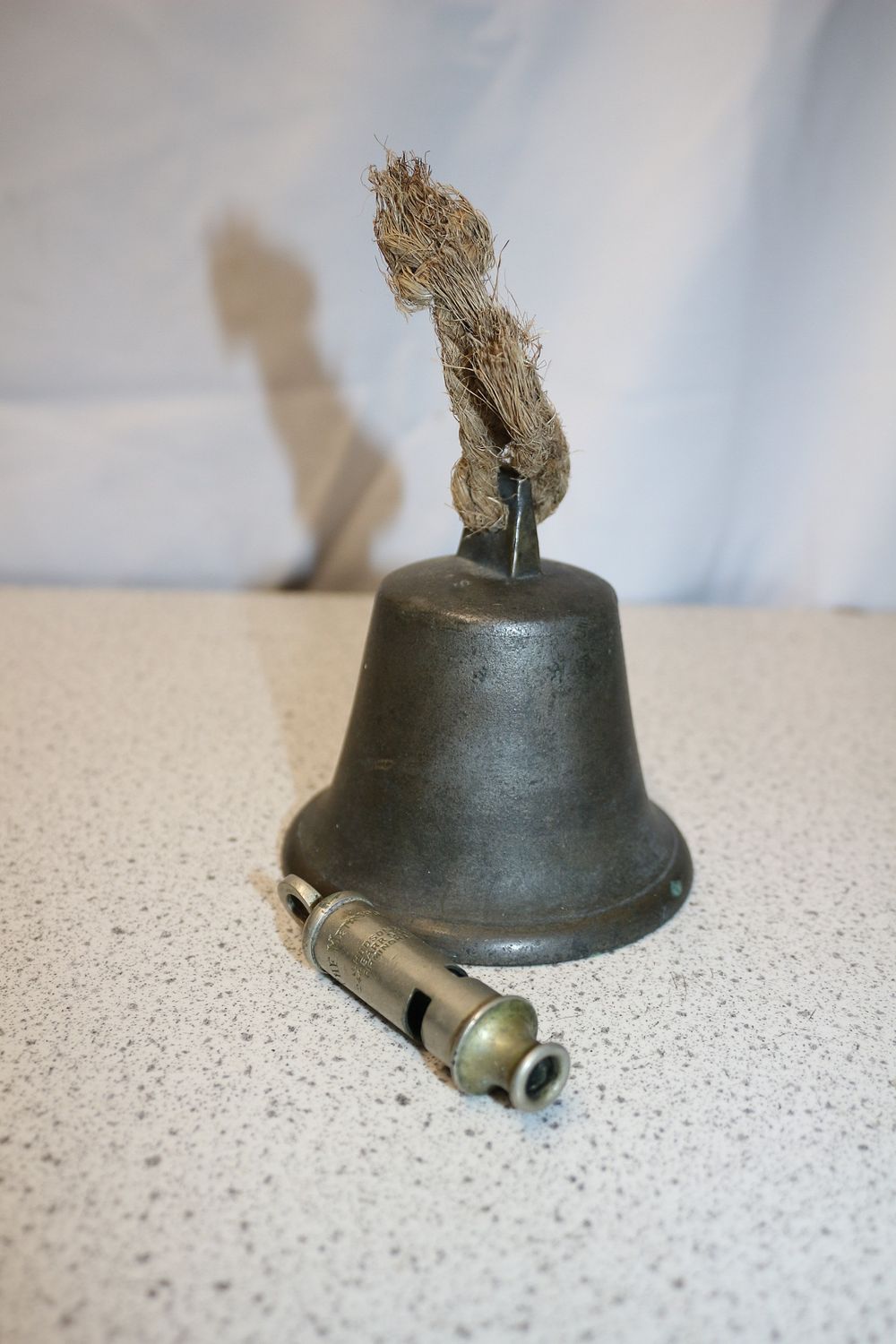Lot 221: A Cast Iron Bell and J. Hudson & Co. Police Whistle