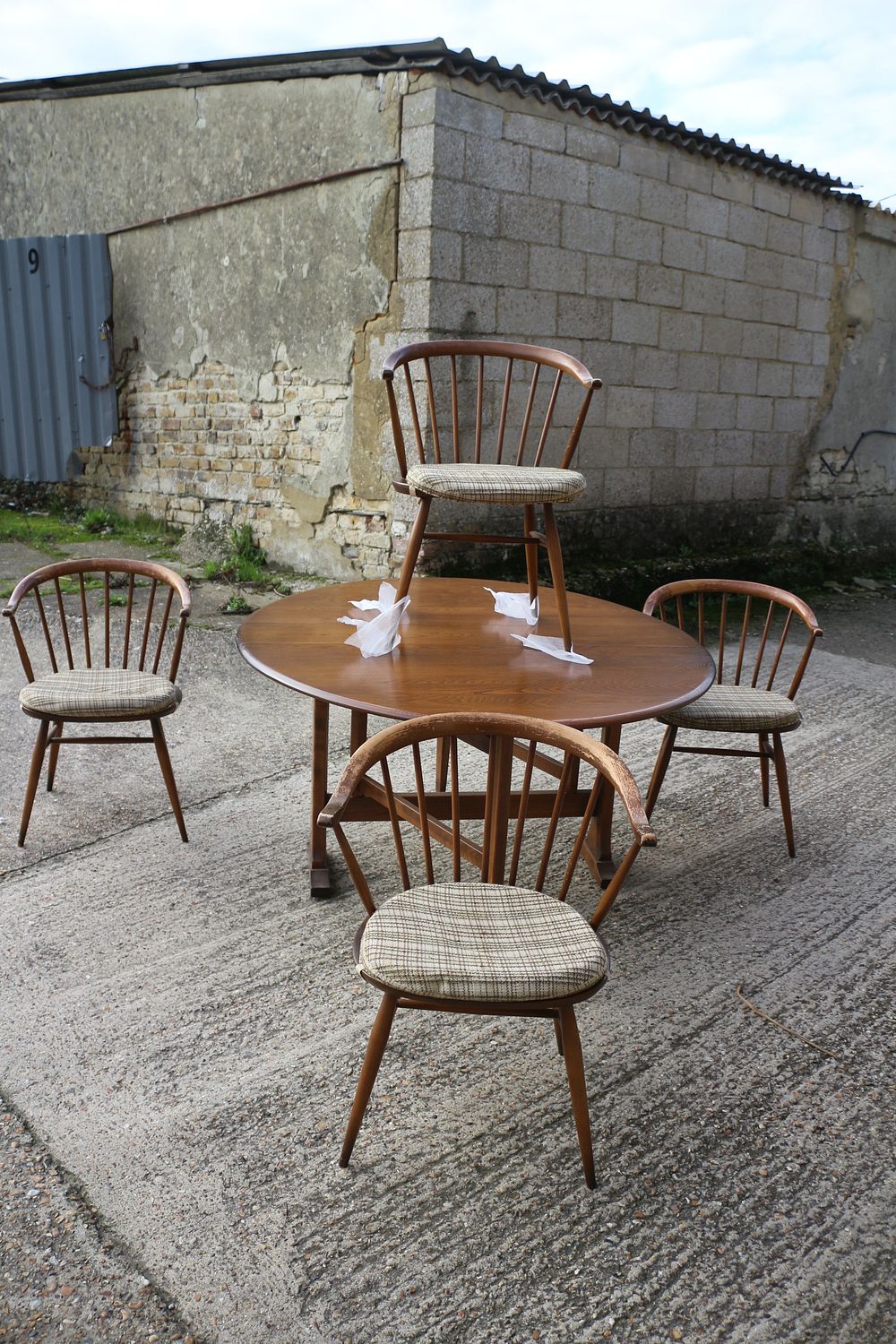 Lot 244: A Combination of Ercol Drop-Leaf Ash Dining Table and Four Elm & Beech Cow Horn Design Chairs