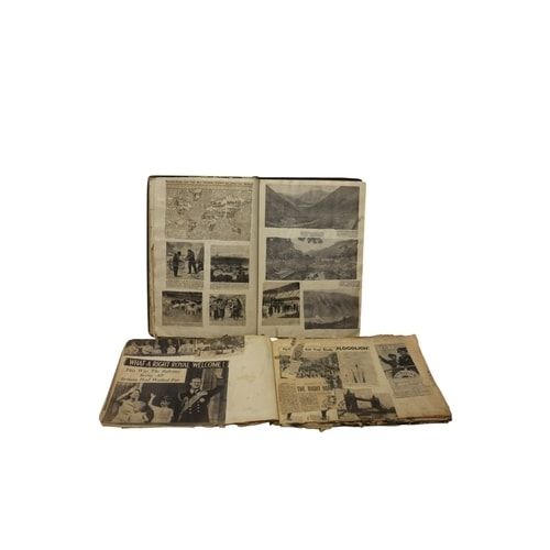 Lot 263: A Collection of Vintage Scrapbook, Newspapers, Stamps, and Book