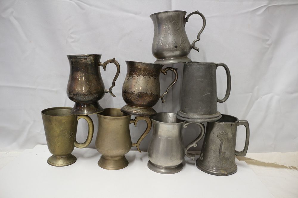 Lot 292: A Group of Pewter and Brass Tankards and Mugs