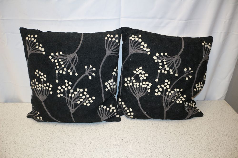 Lot 343: A Pair of Black Floral Pattern Throw Pillows