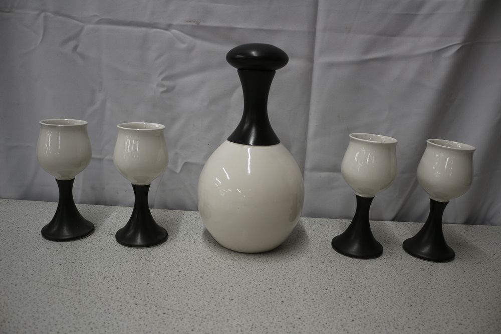 Lot 381: A Set of Iden Pottery of Rye White and Black Ceramic Carafe and Goblets