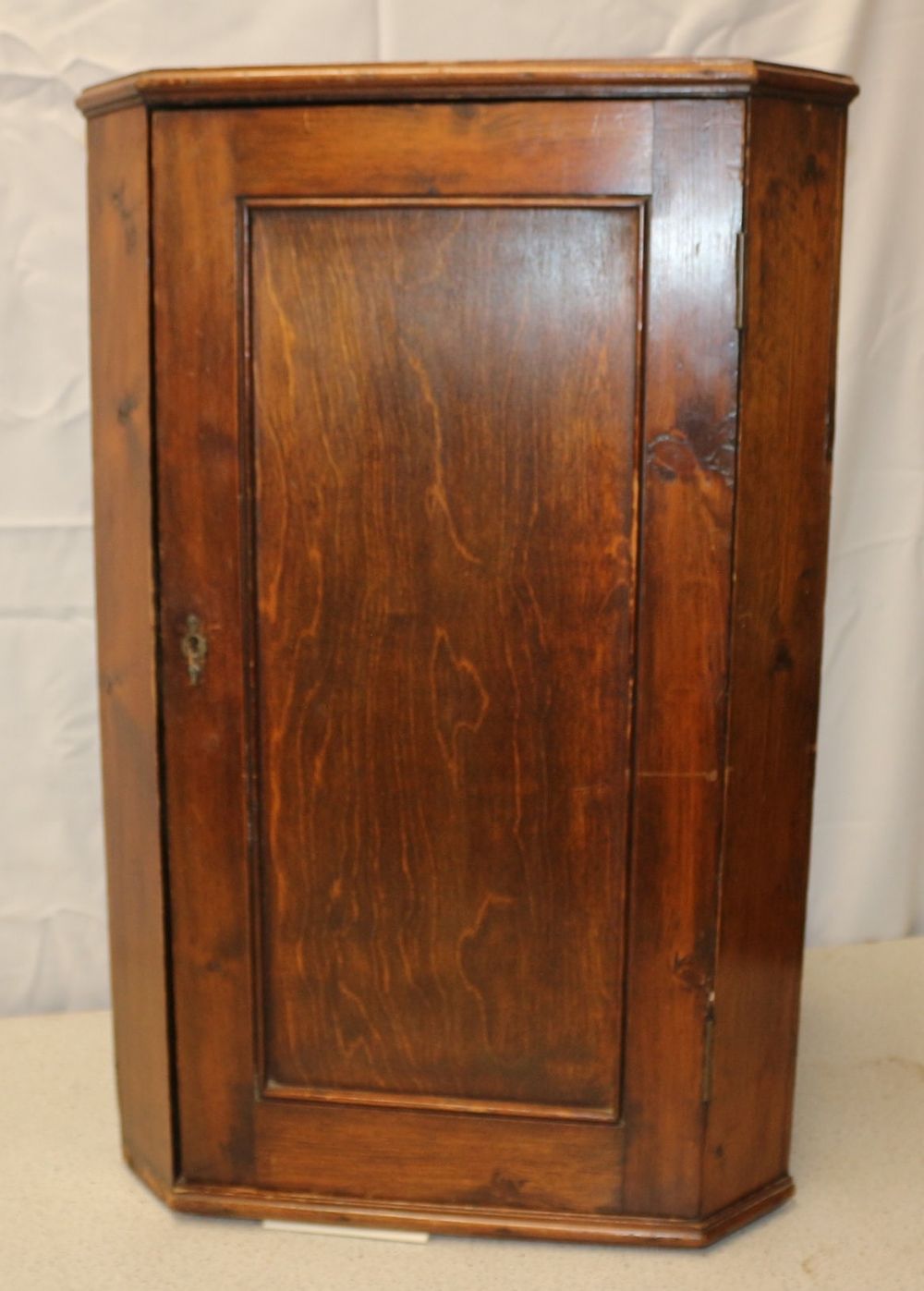 Lot 408: A Brown Wooden Wall Hanging Corner Cabinet with Single Door