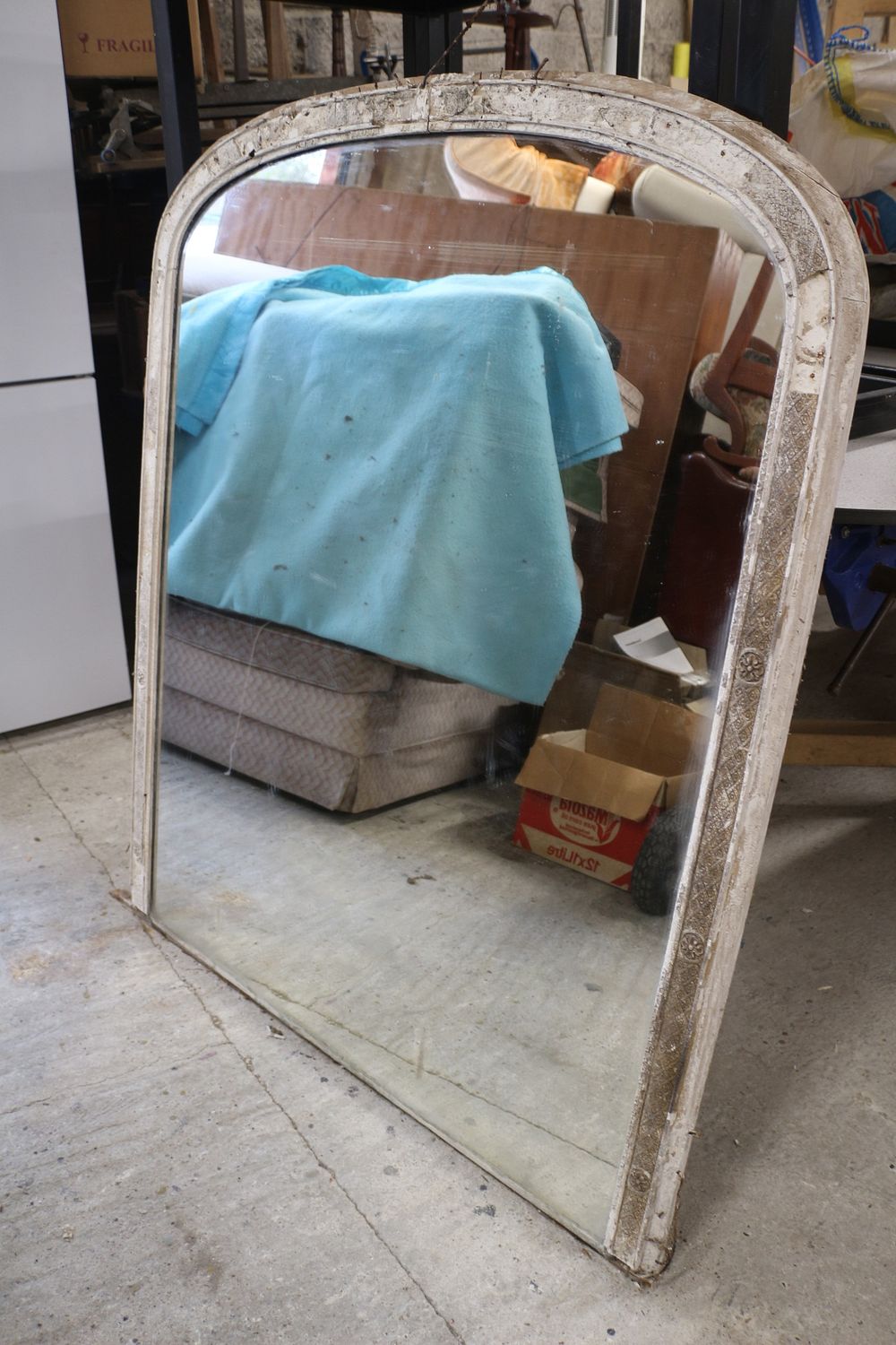 Lot 415: A Distressed Arched Over Mantle Mirror