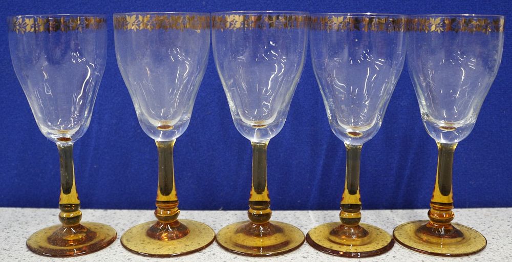 Lot 529: A Set of Five Vintage Clear Glass Amber-Stemmed Goblets with Gilt Rims
