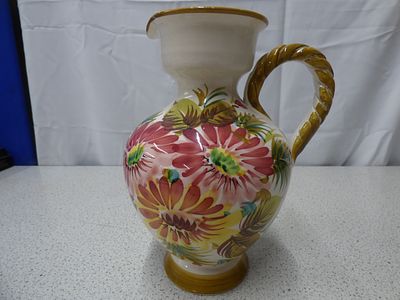 Vintage Italian Sgraffito Hand Painted Floral Ceramic Pitcher. A white ceramic pitcher with a 