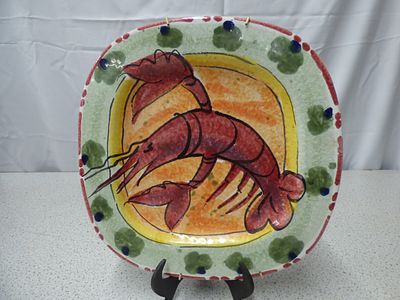 Hand-Painted Italian Ceramic Lobster Plate. A multi-coloured decorative ceramic plate features a 