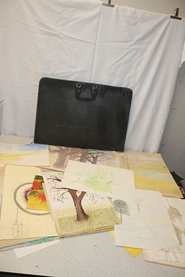 A Black Portfolio Case and Collection of Artworks. A black portfolio case containing numerous 