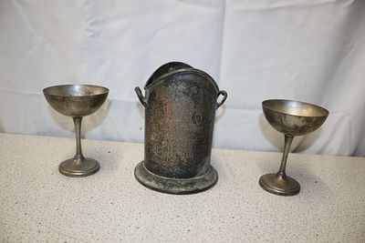 A Pair of Silver Plated Goblets and Wine Cooler. Two tarnished silver plated stemmed metal 