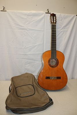 A Fender FC-100 Classical Guitar with Soft Case. One brown/natural wood Fender Model FC-100 