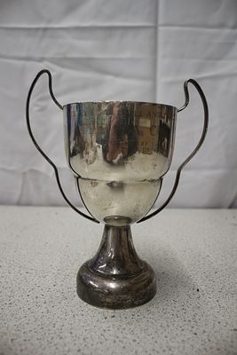 A 1966 Silver Plated Two-Handled Angling Trophy Cup. A silver plated trophy cup with two handles 