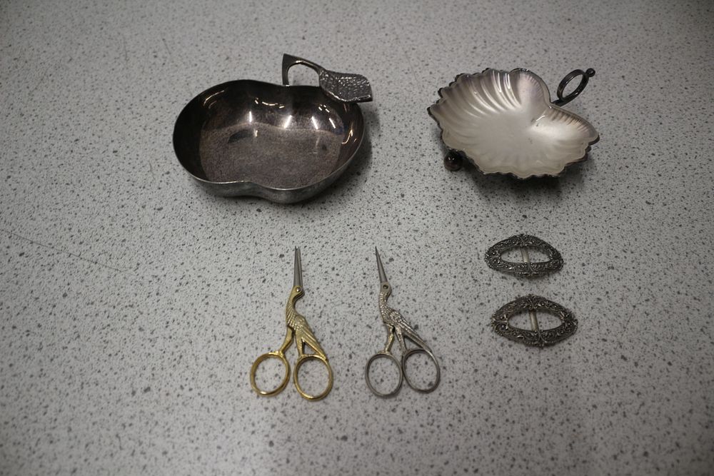 Lot 165: A Collection of Silver-Coloured Dishes, Scissors, and Buckles